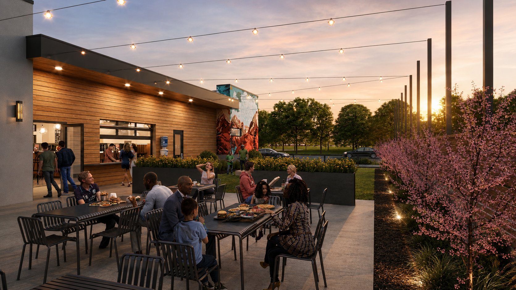 Lafayette North Public Market — east patio at golden hour, string lights, families dining, mural wall visible, Old Town Lafayette Colorado