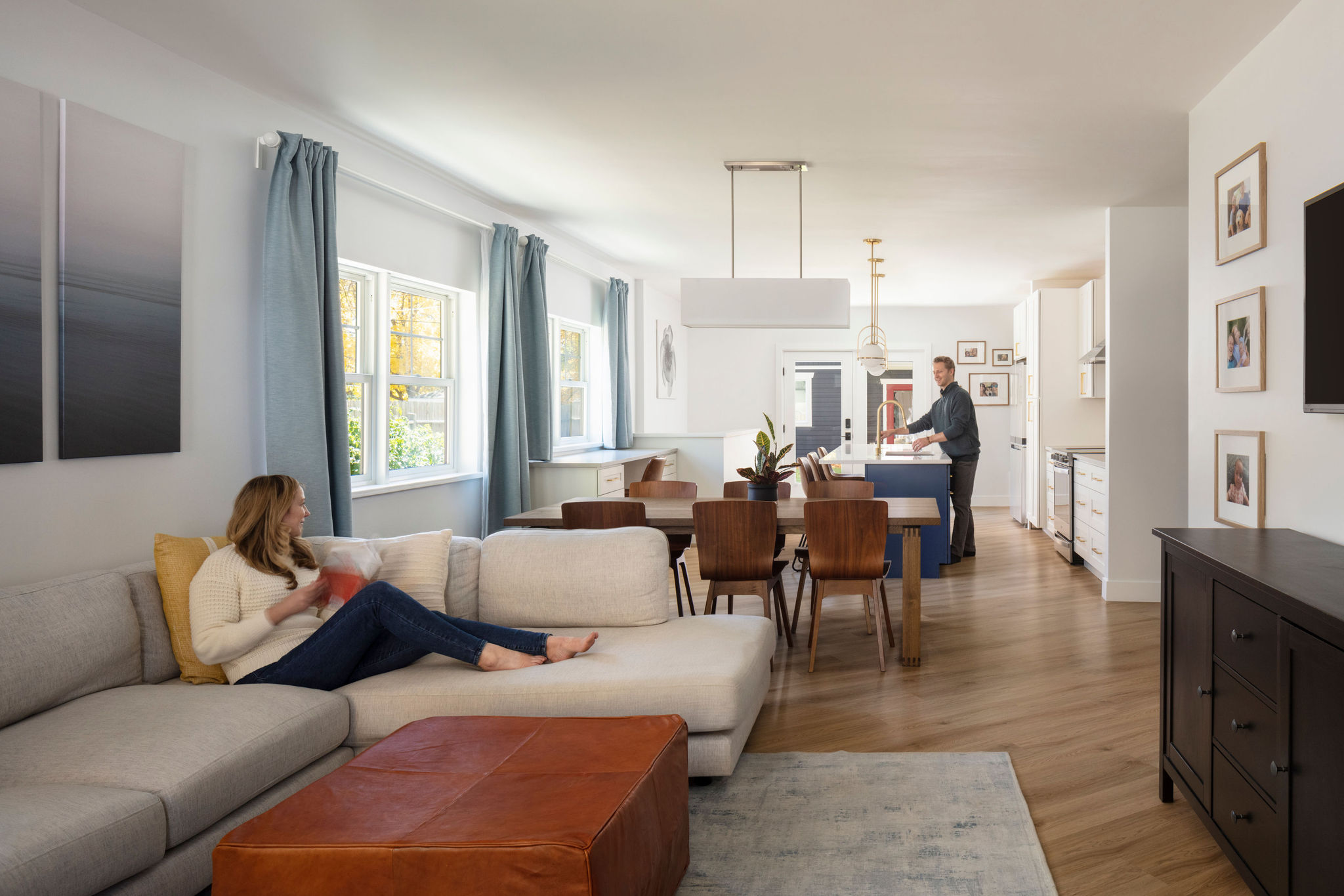 Open living, dining, and kitchen renovation in a Lafayette, Colorado home designed by Intentional Architecture.